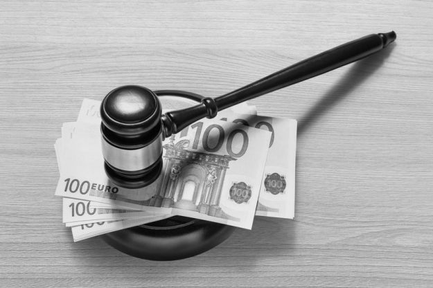 Judge’s gavel and one hundred euro banknotes
